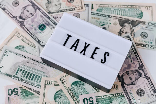 Stop Overpaying Taxes with Proven, Prompt Advisory Services Heap Of American Money Cash And Vintage Light Box